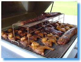 Chicken and ribs on the barbecue grill